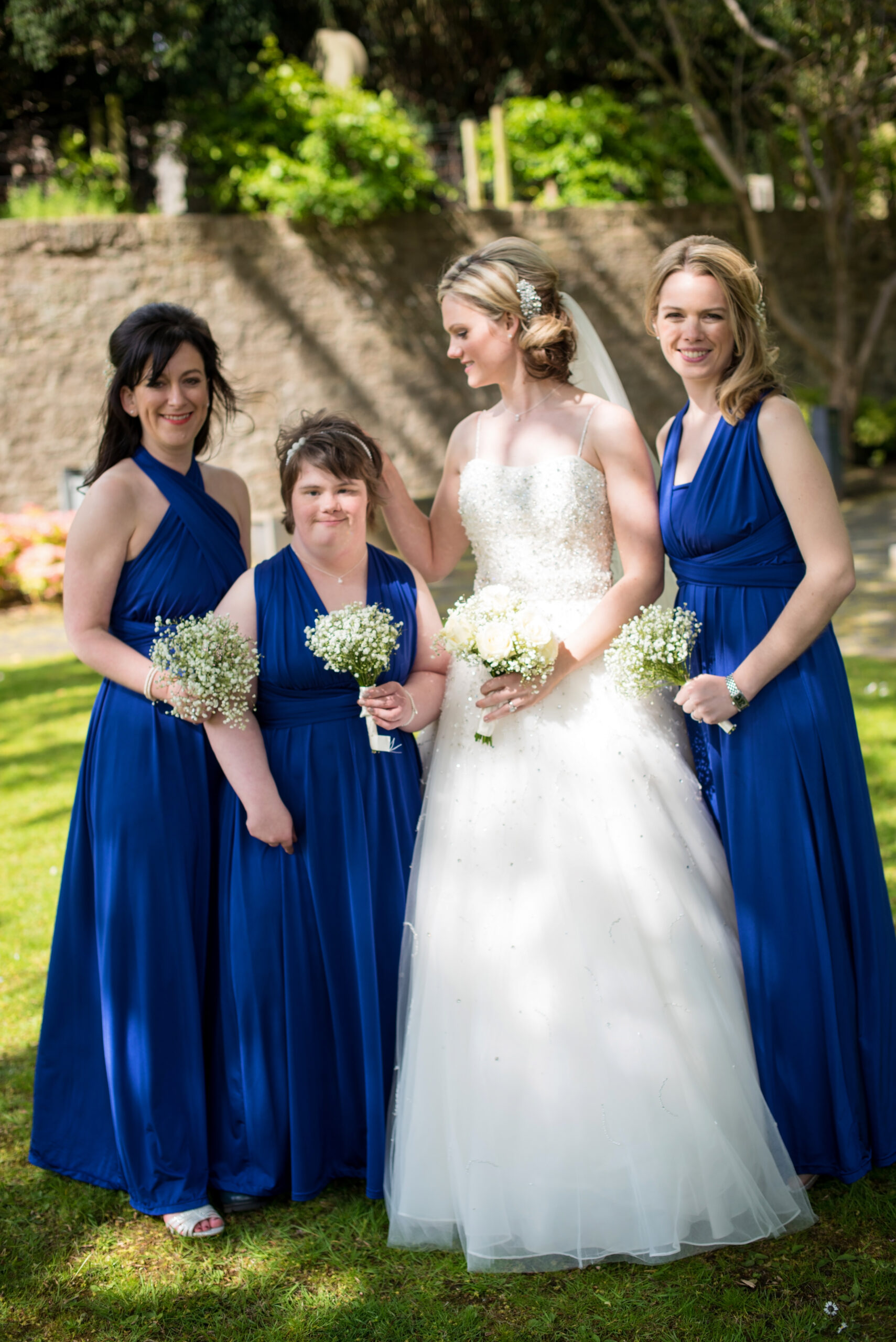 Photo of a bride with her bridesmaids. 